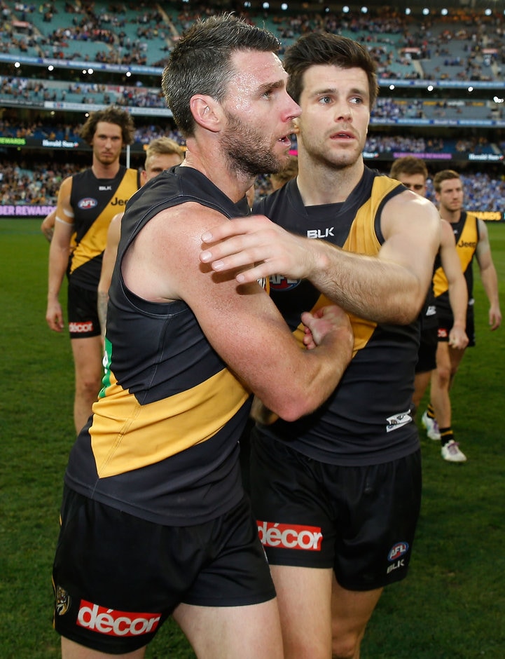 AFL 2015 First Elimination Final - Richmond v North Melbourne MELBOURNE, AUSTRALIA - SEPTEMBER 13: Chris Newman (left) and Trent Cotchin of the Tigers embrace after Newman's last match during the 2015 AFL First Elimination Final match between the Richmond Tigers and the North Melbourne Kangaroos at the Melbourne Cricket Ground, Melbourne, Australia on September 13, 2015. (Photo by Michael Willson/AFL Media)